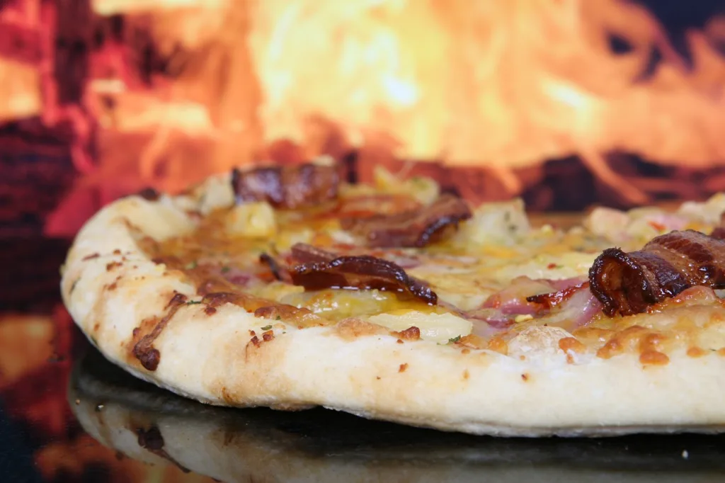 una pizza col bacon, se la mangi significa che non sai come funziona il dimagrimento